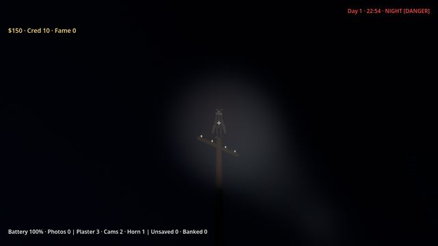 A dark winged figure on a pole lit by a flashlight
