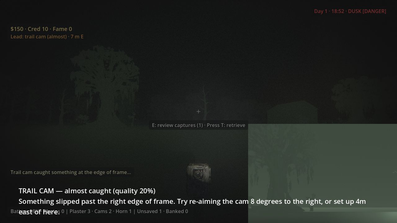 A trail cam on the ground with an almost-caught notice and its preview image